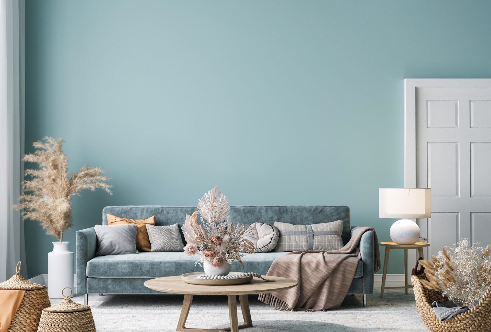 Pillar Painting & Contracting |  Cozy Northern Kentucky living room with freshly painted teal walls and a stylish blue sofa.